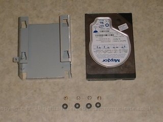 1 myharddrivemountingmodkit.jpg - This was my first hard drive - I started by adding some rubber gromets to take some of the slack. These came from an old HP machine